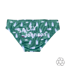 Load image into Gallery viewer, Salty Johnson sustainable mens swim briefs in green with milk bottle print and brand logo