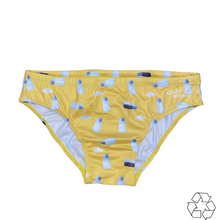 Load image into Gallery viewer, Salty Johnson sustainable mens swim briefs in yellow with milk bottle print and eco-friendly design