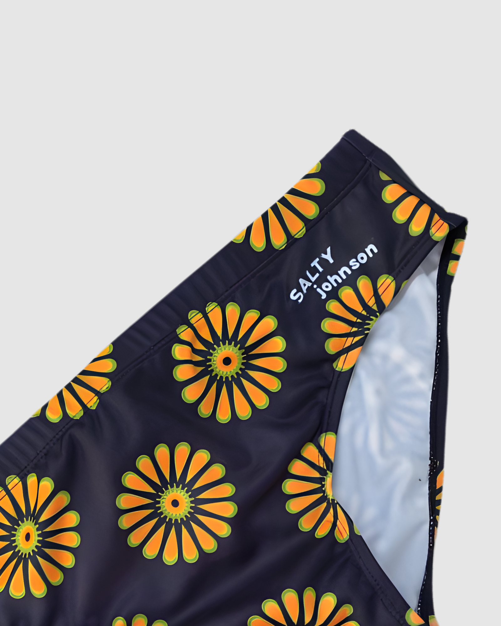 Retro Bloom mens swim briefs, UPF50+ rated sustainable swimwear, Salty Johnson