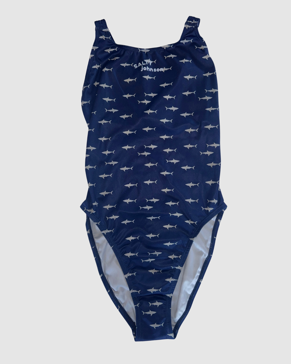 Front view of White Pointer women's thick strap one-piece swimsuit, grey sharks on navy.