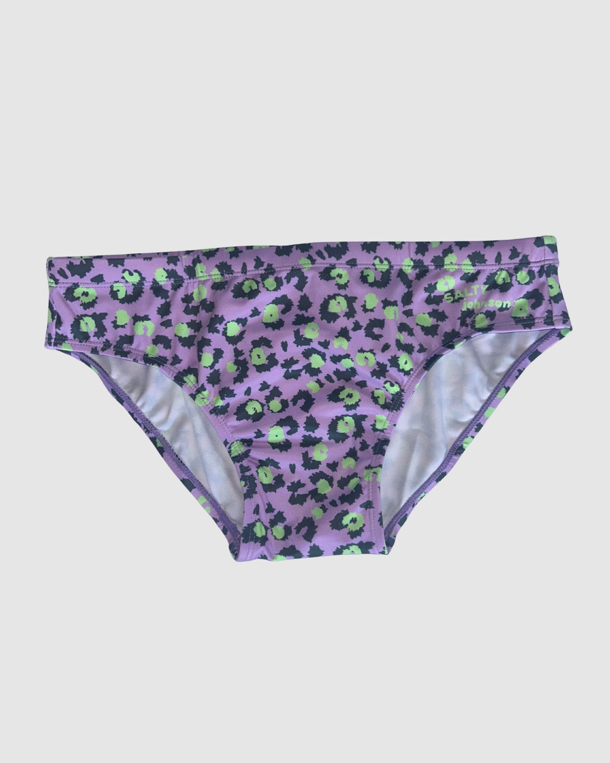 Front view of Salty Johnson Purple Patch men's swim briefs in purple, black, green.