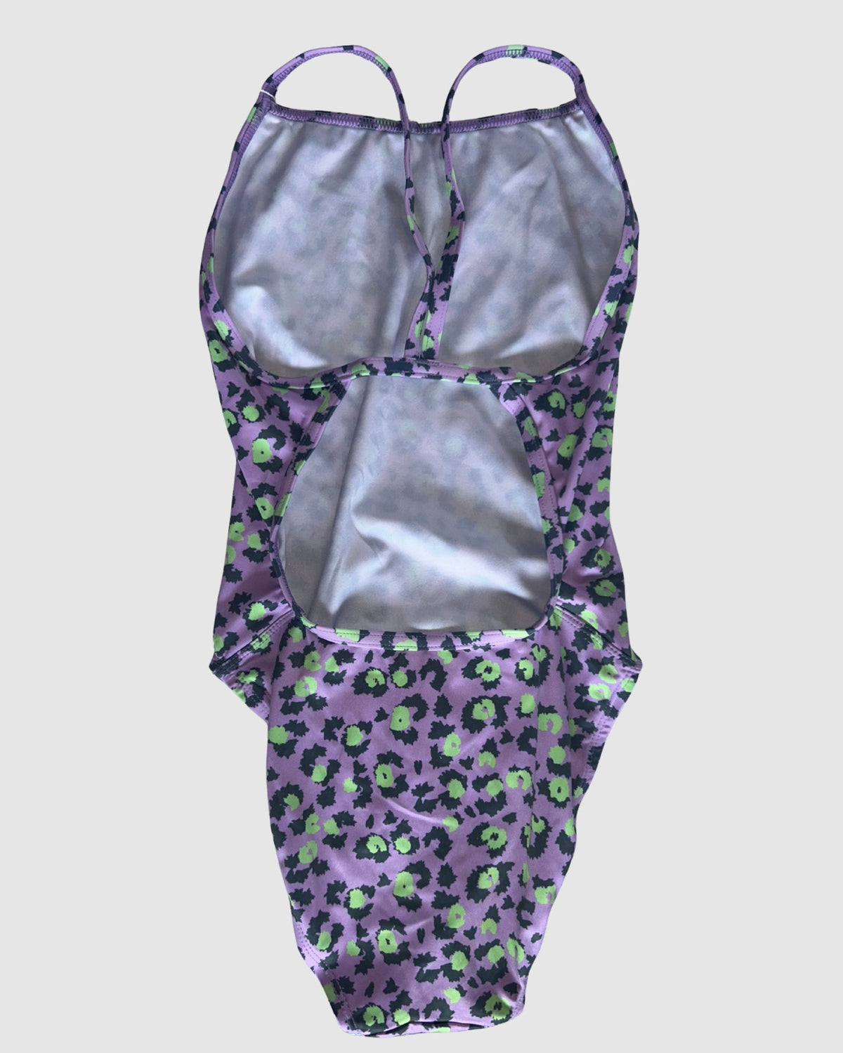 Open cross-back view of Purple Patch women's thin strap one-piece swimsuit, black and lime leopard spots on lilac.
