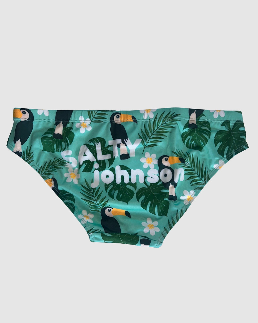 Back view of Salty Johnson Toucan Tango men's swim briefs in green, black, yellow.