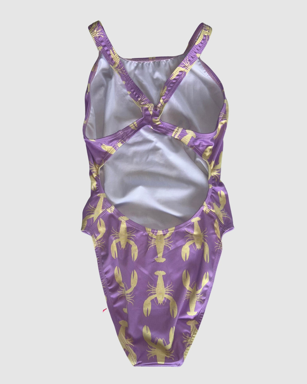Open cross-back view of Yabbies women's thick strap one-piece swimsuit, yellow yabby print on lilac.