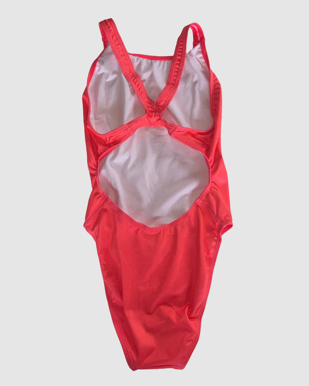 Open cross-back view of Classics Watermelon women's thick strap one-piece swimsuit, solid watermelon red.
