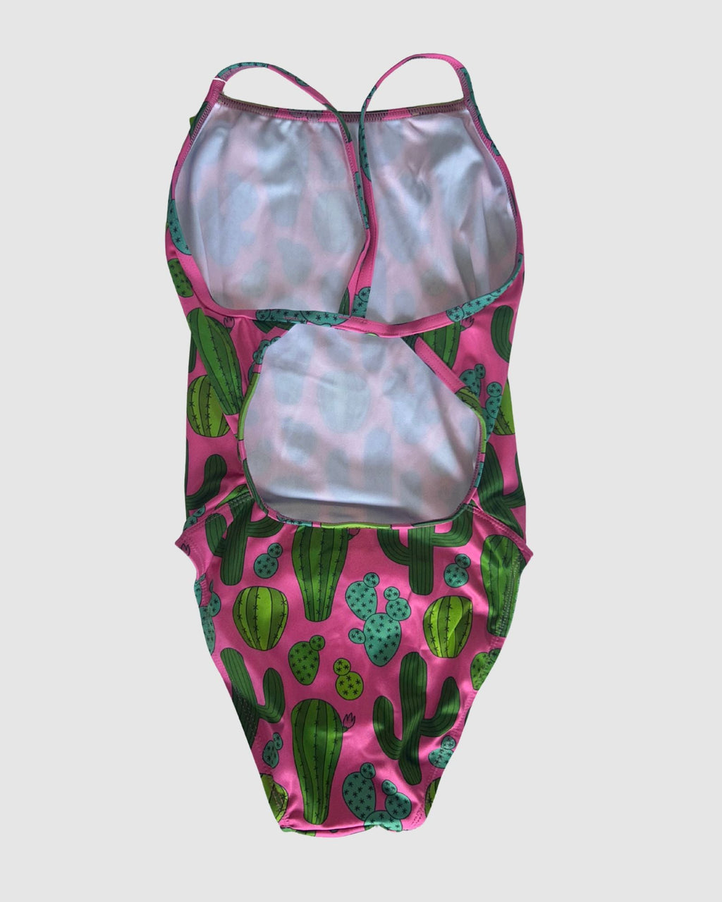 Open cross-back view of Prickly Business Pink women's thin strap one-piece swimsuit, green cactus print on bright pink.