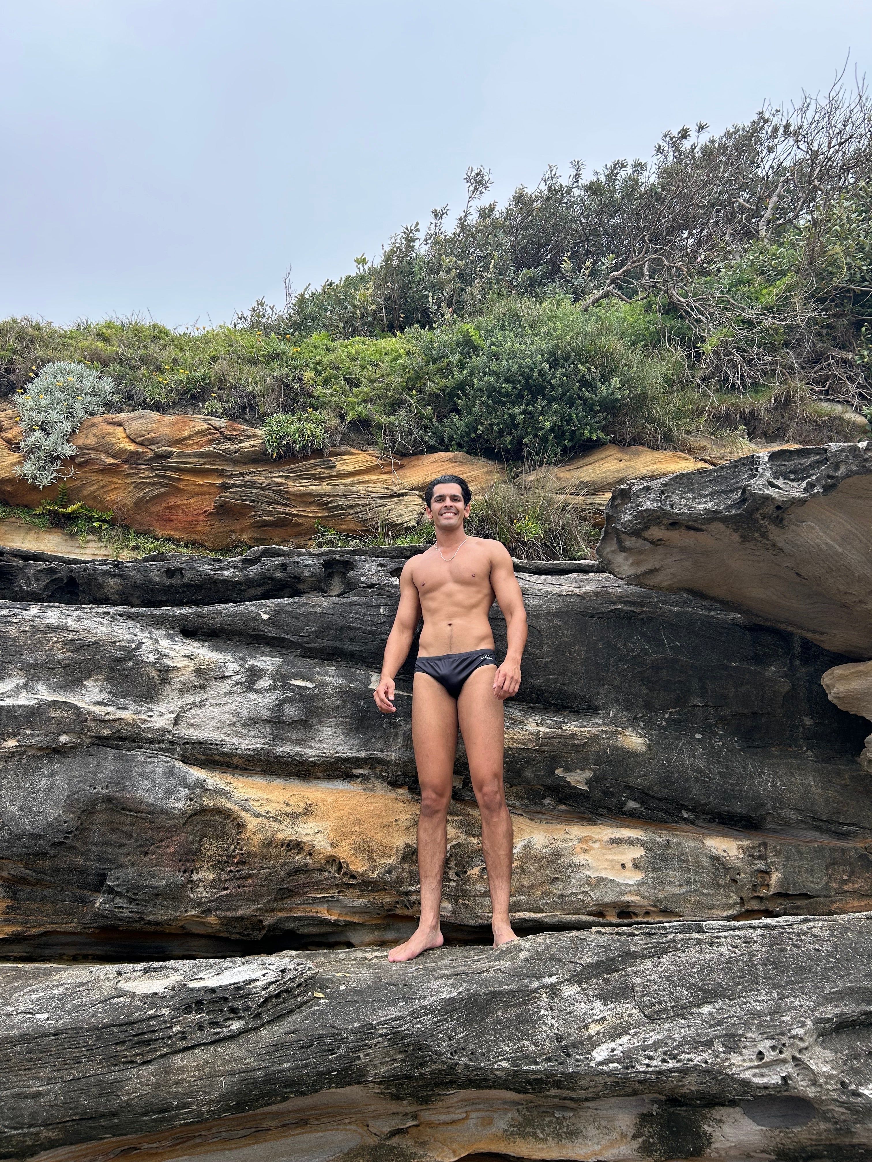 Salty Johnson sustainable mens swim briefs in black, perfect for beach outings and water activities
