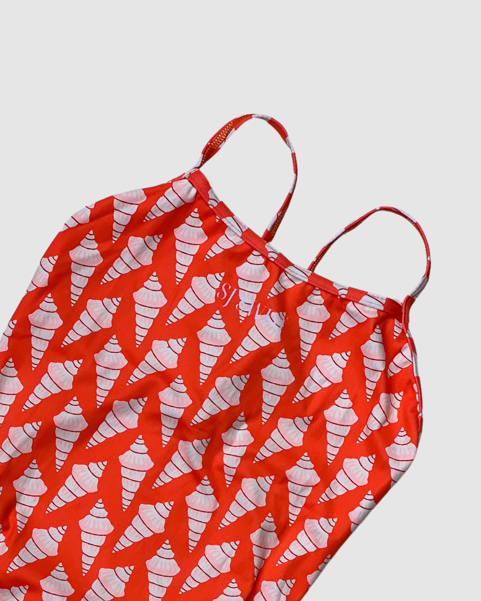 Salty Johnson AU sustainable womens one piece swimsuit in bright red with a unique shell pattern