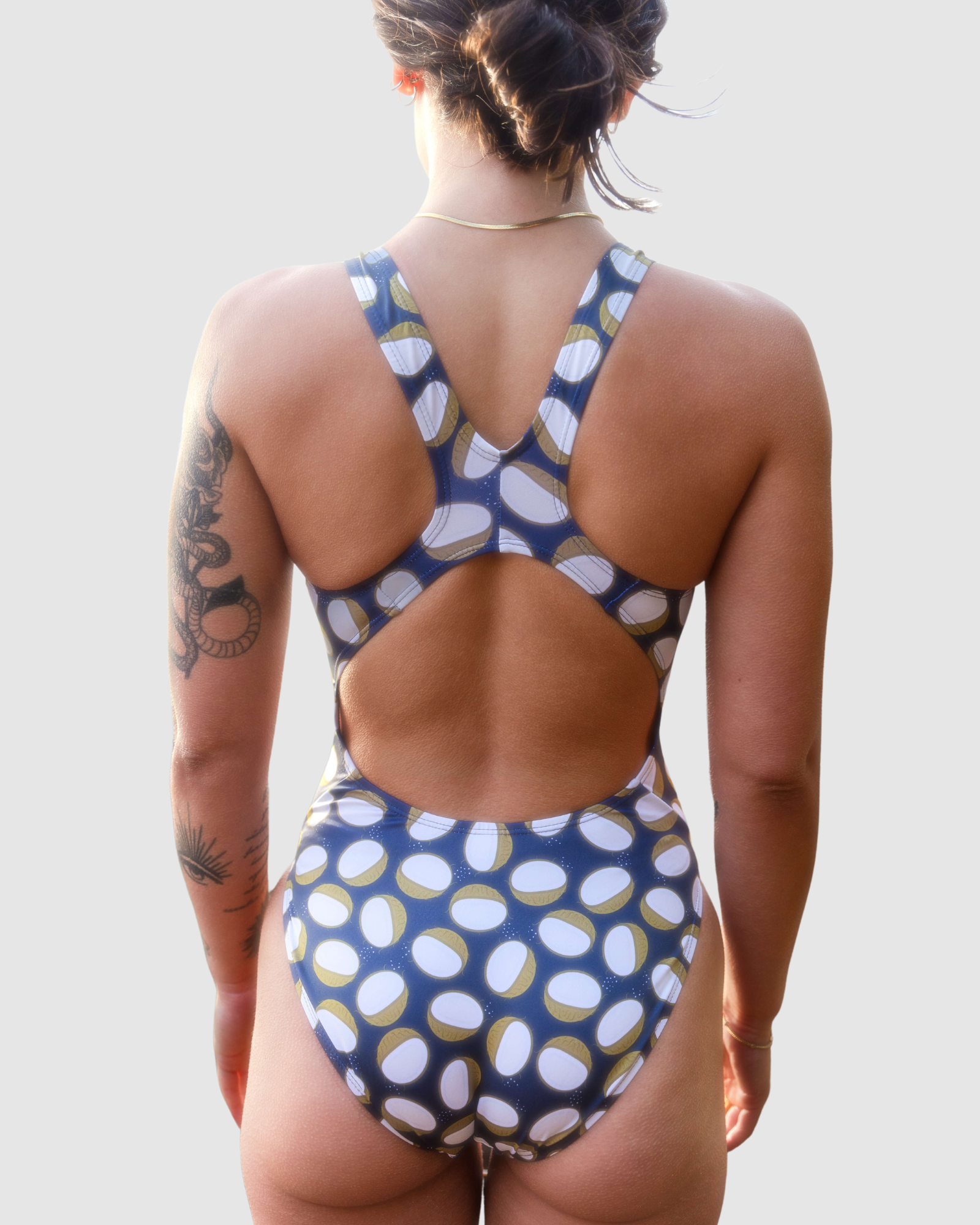 Salty Johnson AU Women's Swimsuit with unique coconut design and racerback cut for comfort and style